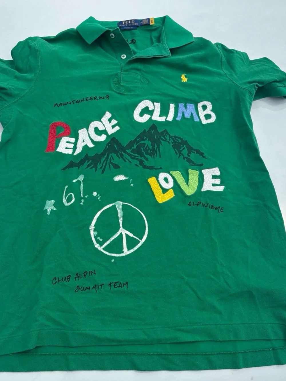 Ralph Lauren Green Polo Shirt with Multicolor 'Peace Climb Love' Graphics